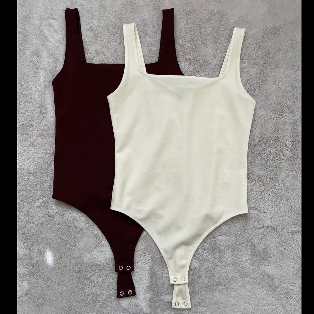 Two express body suits.